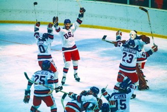 Team USA celebrates it's win over the USSR in the Men's Ice Hockey semi-final at the 1980 Olympic Winter Games.