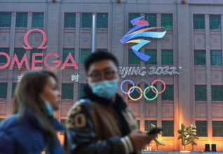 Beijing, China. 10th Feb, 2022. The emblem of the 24th Winter Olympic Games and the Olympic rings hanged on the wall of Beijing department store. The 24th Winter Olympic Games have been held in Februa...