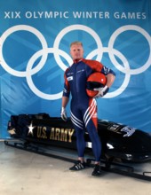 World Class Athlete SPECIALIST (SPC) (E-4) Douglas Sharp, USA, poses with a four-man bobsled. SPC Sharp and his team members won the Bronze medal at the XIX OLYMPIC WINTER GAMES at the Utah Olympic Pa...