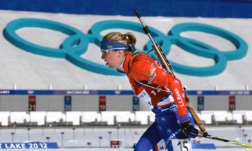Competing in the Biathlon event, World class athlete SPECIALIST Andrea Nahrgang, USA, passes the shooting range, with her .22 caliber, bolt-action rifle slung on her back, at Soldier Hollow during the...