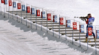 Competing in the Biathlon event, World class athlete Sergeant Kristina Sabasteanski, USA, takes aim with her .22 caliber, bolt-action rifle at one of the five targets in the round. She is the last com...