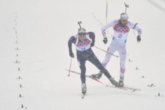 Feb. 18, 2014 - Sochi, Russia - Emil Hegle Svendsen (NOR), left, finishes first for a gold medal ahead of Martin Fourcade (FRA) in the Men's 15km Mass Start Biathlon at the 2014 Winter Olympics in Soc...
