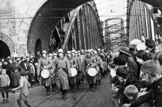 RHINELAND.  German troops marching over the Hohenzollern Bridge into Cologne on 7 March 1936 as part of the reoccupation of the demilitarised zone of the Rhineland