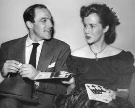 GENE KELLY  (1912-1996) US dancer, actor and film choreographer with his wife Jean