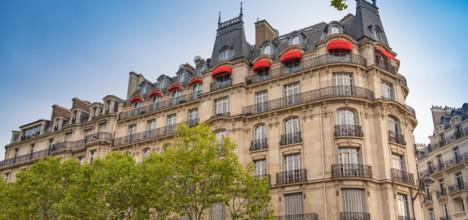 Eiffel tower between Parisian tenement old street alley and buildings, Paris