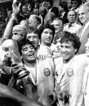 Diego Maradona celebrates the World Championship in Mexico 1986, with the trophy in his hands