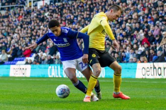 Birmingham, UK. 30th Nov, 2019.  Jude Bellingham of Birmingham City battling with Jake Cooper of Millwall during the Sky Bet Championship match between Birmingham City and Millwall at St Andrews, Birm...