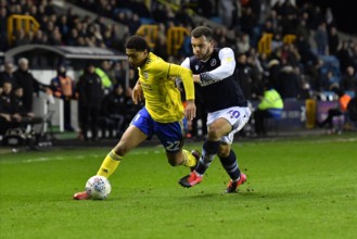 LONDON, ENGLAND - FEBRUARY 26TH Jude Bellingham of Birmingham battles for possession with Mason Bennett of Millwall during the Sky Bet Championship match between Millwall and Birmingham City at The De...