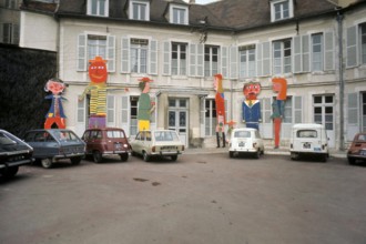 Renault & Citroen cars parked in a square in Auxerre, France in 1973