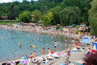 Tuzla, Bosnia and Herzegovina: Pannonian Lakes Complex. Overcrowded open swimming pools during peak of tourist season. Many swimmers in water.