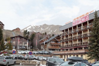 La Toussuire ski resort in Maurienne valley, French Alps, winter season with limited snow and apartment buildings, Savoie, France