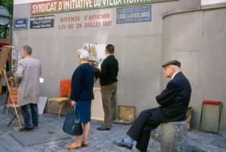 Summer 1963. Artists painting outdoors in Rue Norvins, Montmartre, Paris. Holiday in France. Vacances en France.