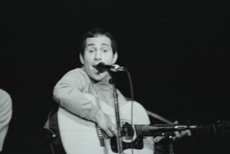 June 17, 1967, Monterey, California, USA - PAUL SIMON performs with Simon & Garfunkle during the Monterey International Pop Music Festival. The festival was a three-day concert event held June 16 to J...