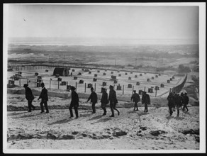 Dominion journalists visited a messenger dog depot in France during World War I. These dogs were vital for carrying messages between units, helping maintain communication in the field under challengin...