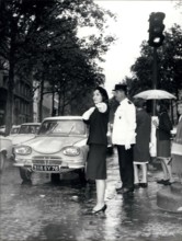 Sep. 16, 1964 - Women as traffic Auxiliaries: The first Auxiliary traffic policewoman pictured in a Paris street this morning.