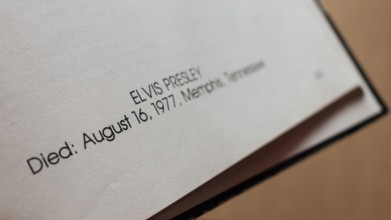 Close-up of 'Elvis Presley' text, showing date and place of death.