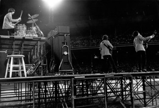 The Beatles during a concert at Shea Stadium
