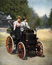 A luxury automobile ca. 1895,  after a colored engraving of "modern sports"
