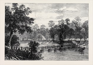 THE ASHANTEE WAR: THE CAMP AT PRAH-SU, NATIVE ARTILLERY CROSSING THE RIVER, 1874
