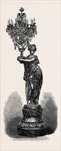 FIGURE HOLDING CANDELABRUM, BY THE COMPAGNIE DES MARBRES ONYX D'ALGERIE, EXHIBITED BY G. VIOT AND