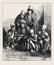 THE FAMINE IN PERSIA: GROUP OF POOR PEOPLE AT SHIRAZ, 1871