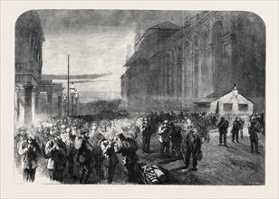 PROGRESS OF THE GREAT INTERNATIONAL EXHIBITION BUILDING: THE WORKMEN LEAVING THE GROUNDS
