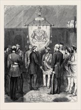 EMPRESS OF INDIA: THE VICEROY PRESENTING TO THE MAHARAJAH SCINDIAH OF GWALIOR A BANNER PREPARED BY