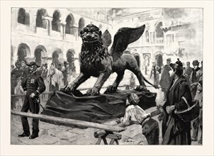 THE WINGED LION OF ST. MARK LYING IN THE PIAZZETTA SAN MARCO, VENICE, ITALY, AFTER BEING TAKEN DOWN