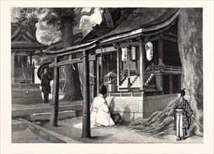 A PRIEST BEFORE A FOX SHRINE, JAPAN. In Japan the Fox is regarded with great respect as being the