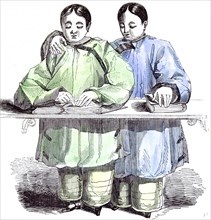 The blind chinese children, Agnes and Laura, reading the lesson, the invention of characters in