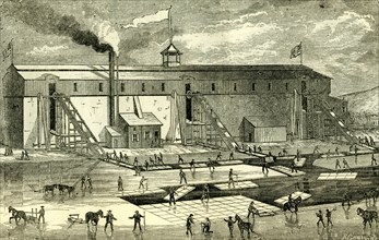 Ice Industry; U.S.A.; 1881; winter view of elevating ice into buildings