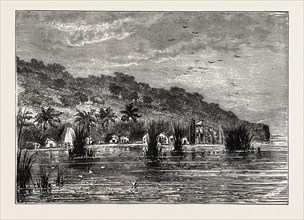 AN ENCAMPMENT ON THE SHORES OF LAKE TANGANYIKA, an African Great Lake. The lake is divided among