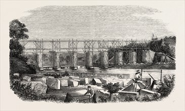 Construction of the viaduct of Mayenne, in Laval (railroad west), France. engraving 1855