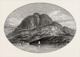 TORGHATTEN FROM THE EAST. Torghatten is a mountain on Torget island in BrÃ¸nnÃ¸y municipality in