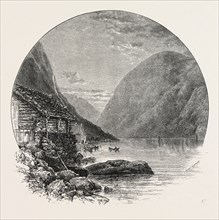 GUDVANGEN AND THE NAERÃñ FJORD. Gudvangen is a village in the municipality of Aurland in Sogn og