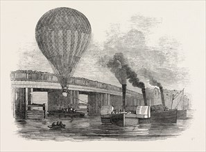 THE NASSAU BALLOON PASSING BATTERSEA BRIDGE, ON ITS PASSAGE UP THE THAMES, UK, 1846