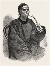 A TRADESMAN OF TIEN-TSIN, THE TREATY PORT OF THE PROVINCE OF PE-CHILI, CHINA