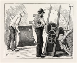 MANUFACTURING AN ELECTRIC TELEGRAPH CABLE: COATING THE ELECTRIC CORE WITH JUTE, 1873