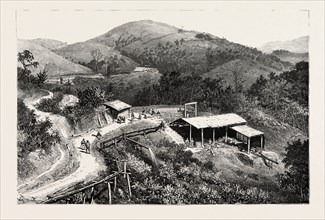 GENERAL VIEW OF THE MINES, SHOWING THE ENTRANCE TO ONE OF THE LARGE TUNNELS GOLD MINING IN WYNAAD