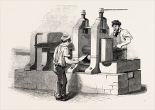 THE MANUFACTURE OF STEEL PENS IN BIRMINGHAM, UK: ROLLING THE STEEL FOR PENS, 1851 engraving