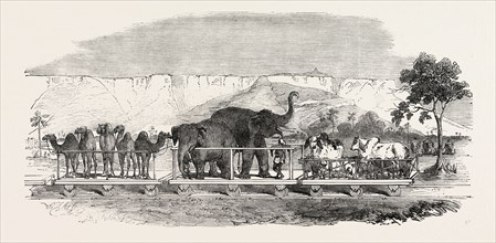RAILWAY FROM CALCUTTA TO DELHI: BAGGAGE TRAIN PASSING THE FORTRESS OF RHOTAS, INDIA, 1851 engraving