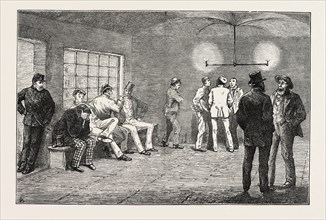 IN THE CELLARS AT NEWGATE: PRISONERS WAITING FOR THE COURT TO OPEN, LONDON, UK, 1873 engraving