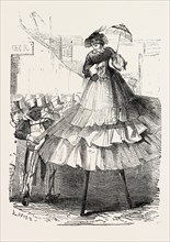 THE DERBY DAY, SCENES BY THE ROADSIDE AND ON THE DOWNS: CRINOLINE ON STILTS. UK, 1860 engraving