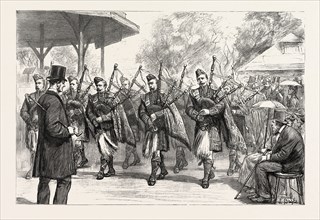 THE MILITARY EXHIBITION: THE PIPERS OF THE ARGYLE AND SUTHERLAND HIGHLANDERS PARADING THE GROUNDS,