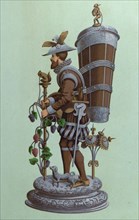 Table centrepiece, surtout de table, depicting a man wearing a sword, holding a staff surmounted by
