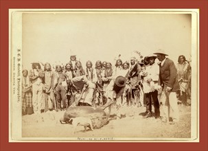Skinning beef at beef issue, John C. H. Grabill was an american photographer. In 1886 he opened his