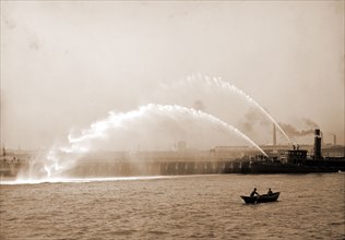 Fireboat 44 in action, Boston, Mass, Fireboats, Waterfronts, Rowboats, United States,