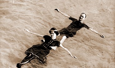 Man and woman floating on their backs in water, Couples, Swimming, 1900