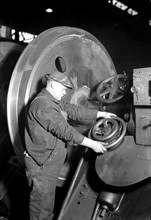 Eddystone, Pennsylvania - Railroad parts. Baldwin Locomotive Works. Machinist machining wheel to