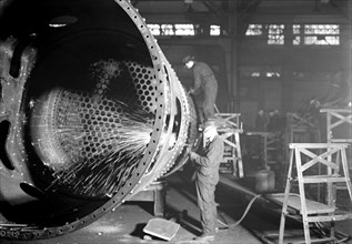Eddystone, Pennsylvania - Railroad parts. Baldwin Locomotive Works. [Man at work.], 1936, Lewis